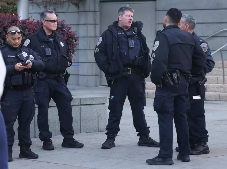 San Francisco police officers patrol Union Square at the opening celebration of the Safeway Holiday Ice Rink in Union Square on Monday, Jan. 1, 2024.