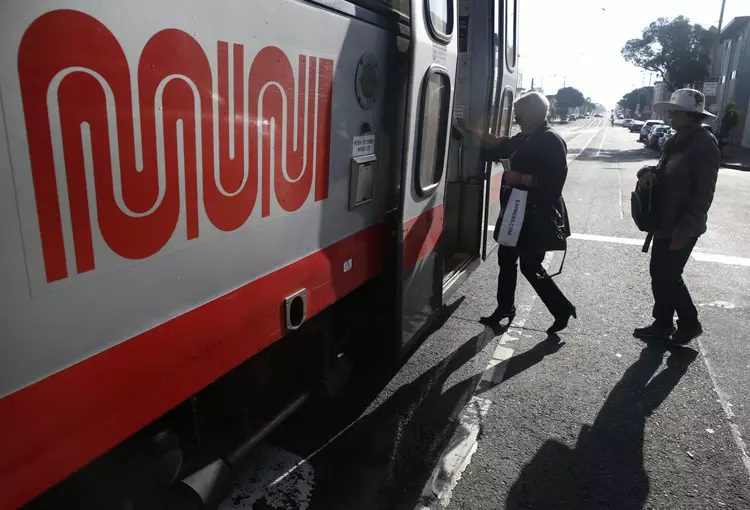 Passengers board a Muni streetcar in San Francisco.