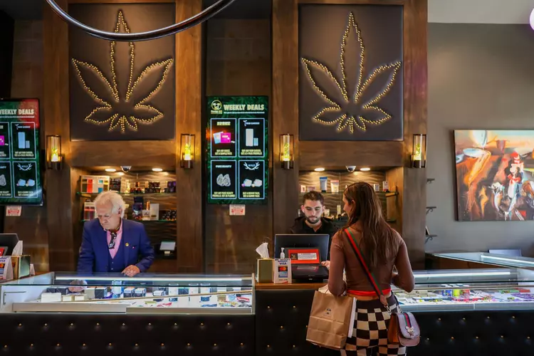 A customer makes a purchase at the Russian Hill Cannabis Club in San Francisco on Jan. 25, 2023. | Camille Cohen/The Standard