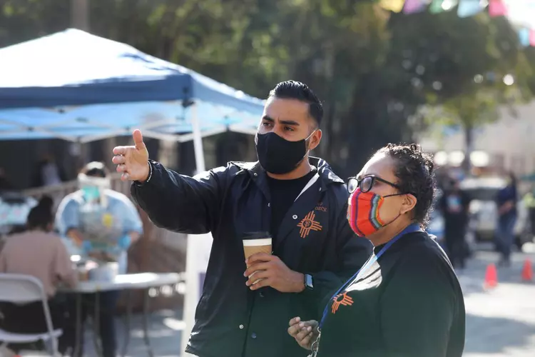 Jon Jacobo (left) of Latino Task Force health committee, talks Latino Task Force staff member on Thursday, Nov. 5, 2020 in San Francisco. | Lea Suzuki/The San Francisco Chronicle via Getty Images
