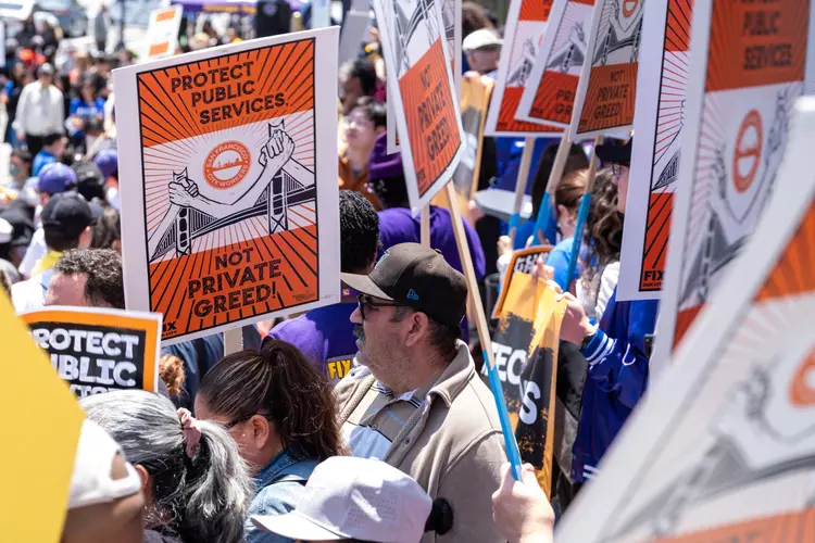 City grantees and their allies rally Wednesday at City Hall to protest belt-tightening measures.